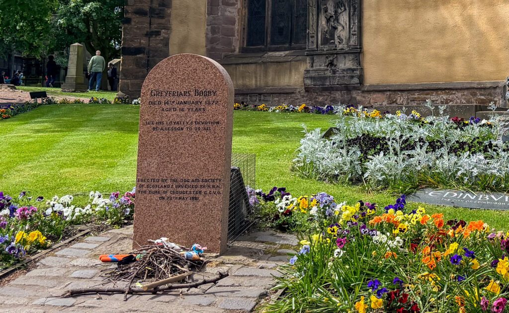 GreyFriars Bobby's grave. Note the sticks.