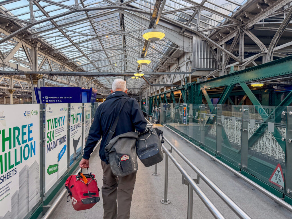 How it ended. Edinburgh. He insisted on carrying my heaviest pannier. Who am I to decline the offer of a bag carry? Train Station Edinburgh